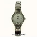 *Ladies' Seiko stainless steel wristwatch, circular silvered textured dial with date aperture, and