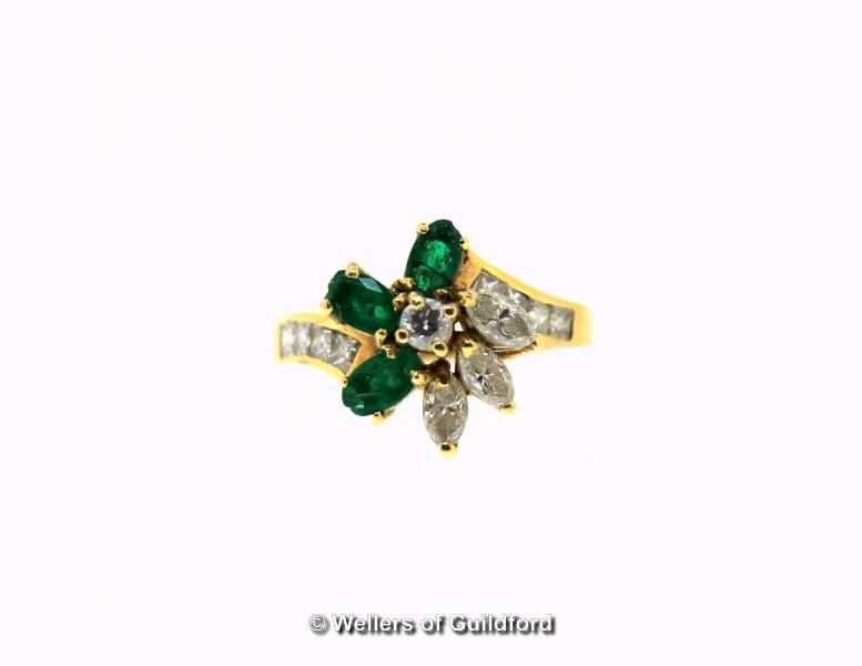 Emerald and diamond cluster ring, central round brilliant cut diamond surrounded by three marquise