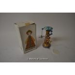 A Russian tinplate wind up doll, boxed; a tinplate toy with aeroplanes (2)