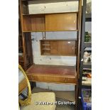 A retro teak double sided free-standing wall unit with sliding door cupboards and leatherette