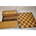 An Anri chess set in fitted box with a chess board.