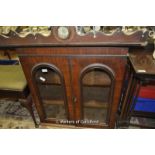 A Victorian mahogany wall cupboard with pair of glazed doors.