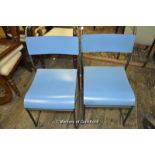 A pair of aluminium framed stacking chairs with laminated seat and back.