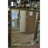 A gilt-framed bevelled wall mirror, 99 x 127cm overall.