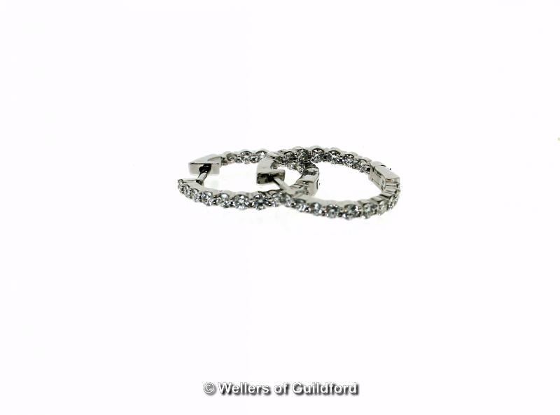 *Pair of diamond hoop earrings, each hoop set with sixteen round brilliant cut diamonds in 18ct