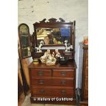 An Edwardian dressing table, the superstructure fitted with two drawers and three mirrors, over