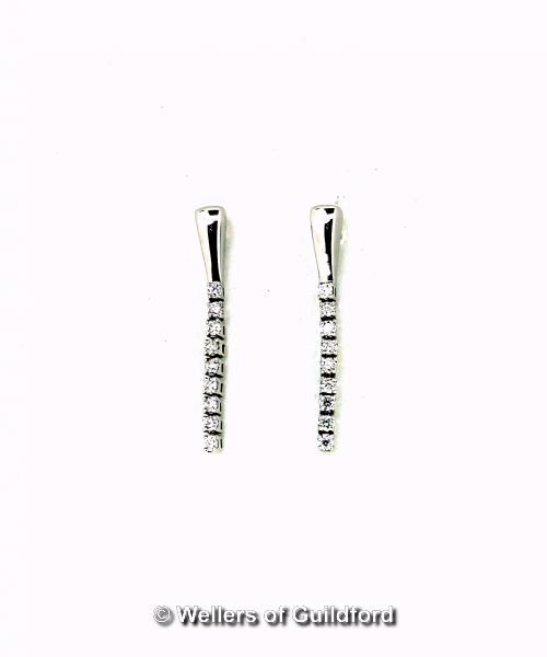 Pair of 9ct white gold diamond set drop earrings, each earring consisting of nine round brilliant