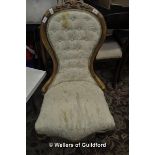 A Victorian spoonback salon chair.