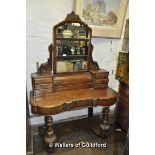 A Victorian walnut duchess dressing table with an arrangement of drawers.