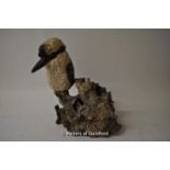 A resin model of a kookaburra seated on a piece of bur wood, 33cm.