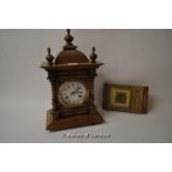 A modern oak mantle clock with two train movement.