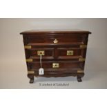 A brass bound mahogany jewellery box, with hinged lid over two short and one long drawer with