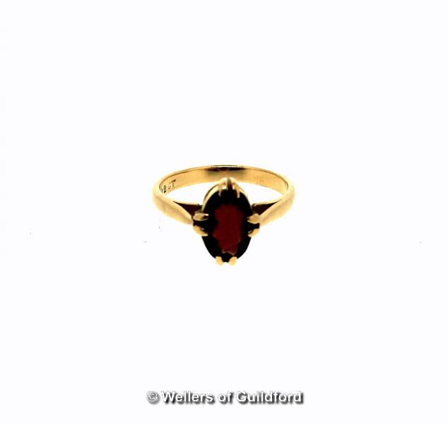 Single stone garnet ring, oval cut garnet mounted in yellow metal stamped 22ct, ring size J