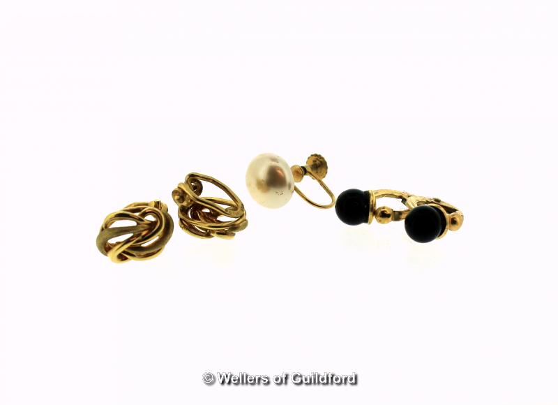 Pair of 9ct yellow gold clip on earrings set with a black stone, a pair of 9ct yellow gold twist