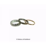 Two 18ct white gold band rings, and a yellow metal twist ring tested as 18ct, total weight 10.0