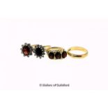 Three 9ct yellow gold stone set rings, including a three stone garnet ring, together with a 9ct