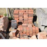 *PALLET OF APPROX ONE HUNDRED MAINLY RED PAVING BRICKS
