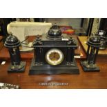 A Victorian black slate mantle clock garniture, the clock with white enamel dial, two train movement