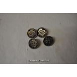 A set of four Chinese white metal buttons.