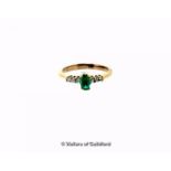 Emerald and diamond ring, oval cut emerald with three round brilliant cut diamonds set to either