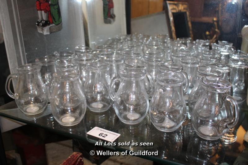 COLLECTION OF TWENTY SIX SMALL GLASS JUGS