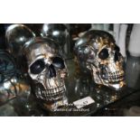 PAIR OF SILVER SKULLS