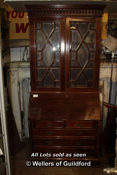 GEORGIAN STYLE MAHOGANY BUREAU BOOKCASE COMPRISING TWO GLAZED DOORS ABOVE THE PULL DOWN BUREAU FRONT