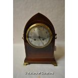 A late 19th Century mahogany mantel clock with arched top, boxwood stringing, the silvered dial with