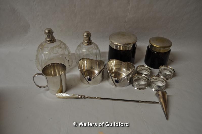 A graduated pair of etched glass scent bottles of lobed form, with silver plated mounts; silver