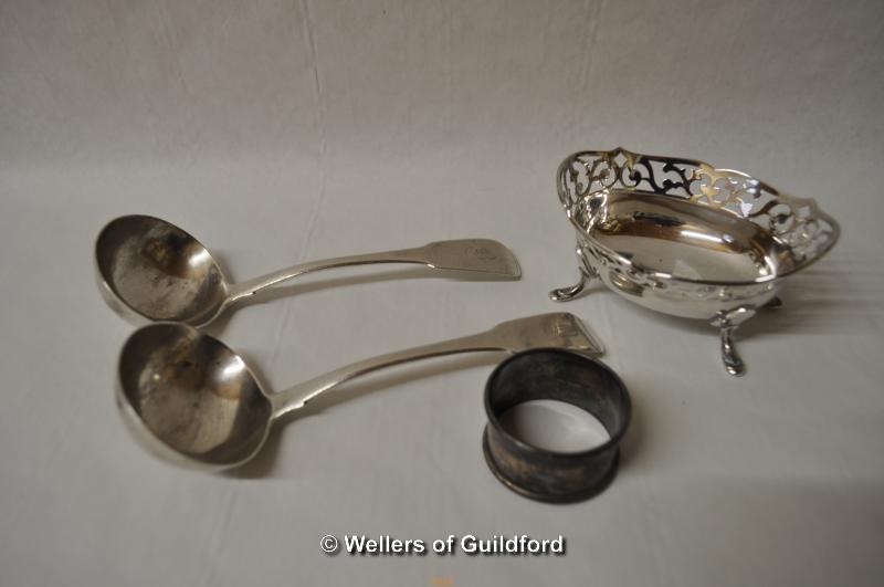 A pair of silver fiddle sauce ladles with monogrammed terminals, London 1896; a small silver oval