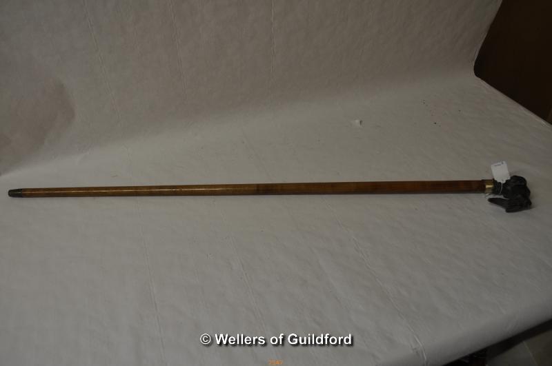 A walking cane, the brass handle modelled as a spaniel dog with pheasant in its mouth.