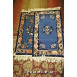 A pair of Chinese blue and pink rugs, 108 x 62cm.