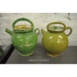 Two French pottery lidded jugs in green glaze, the largest 33cm.