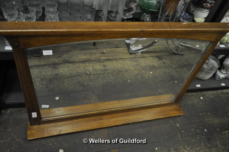 An oak rectangular overmantle mirror, 115cm wide.