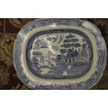 A Willow pattern blue and white ironstone meat dish.