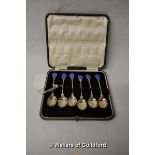 A set of six white metal coffee spoons with blue enamel terminals, stamped 'silver', cased.