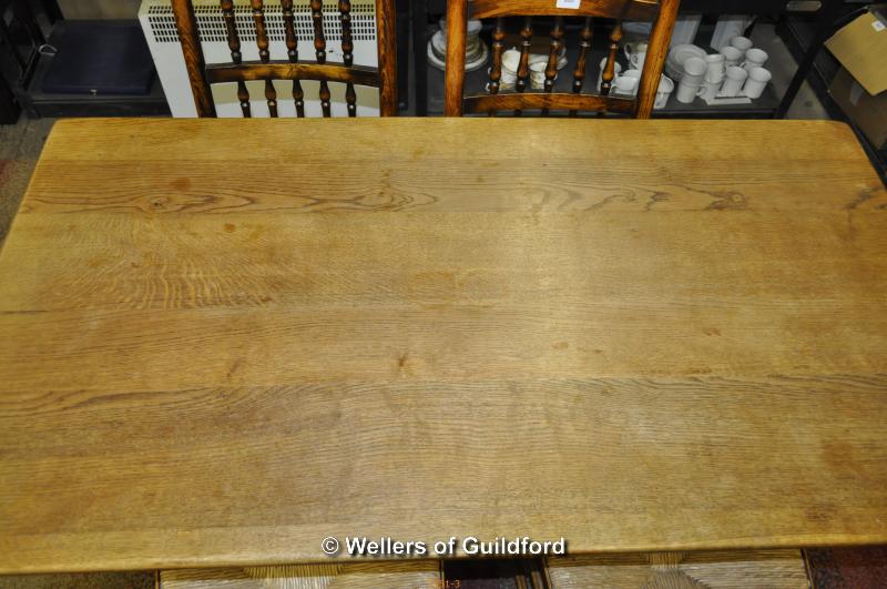 A small oak refectory table, 138 x 74cm, and set of four spindle back oak chairs with rush seats. - Image 4 of 4