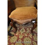 A Victorian rosewood stool of shaped form raised on cabriole legs.