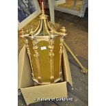 An imposing brass lantern of tapering octagonal from with yellow glass inserts, approx 85cm.