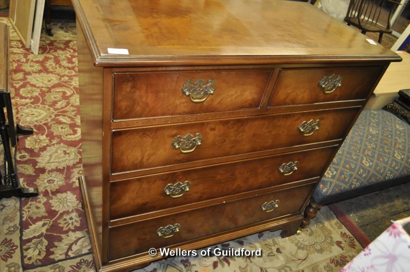 A walnut finish chest of two short and three long drawers, 91 x 90 x 47cm.