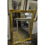 A modern rectangular gilt wall mirror with bevelled glass, 102 x 72cm overall.