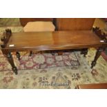 A Victorian mahogany window seat raised on turned legs, 109cm wide.