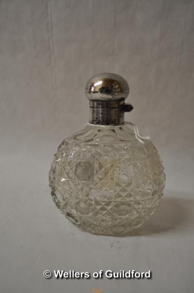 A hobnail cut glass scent bottle with hinged silver lid, Birmingham 1908.