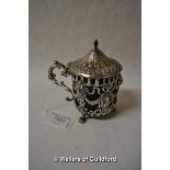 A French silver lidded mustard pot, blue glass liner and scroll handle, import marks for London