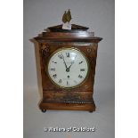 An early 19th Century mahogany cased mantel clock with pineapple finial and brass inlay, the white