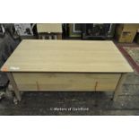 A modern light oak coffee table with single drawer, 108cm wide.