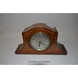 A small Edwardian mahogany mantel clock.