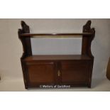 An Edwardian mahogany wall shelf.