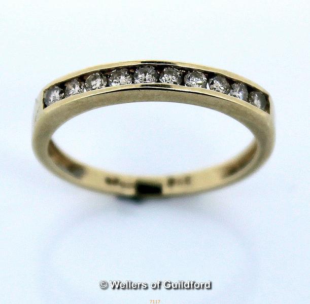 Diamond set half eternity ring, round brilliant cut diamonds channel set in yellow metal stamped