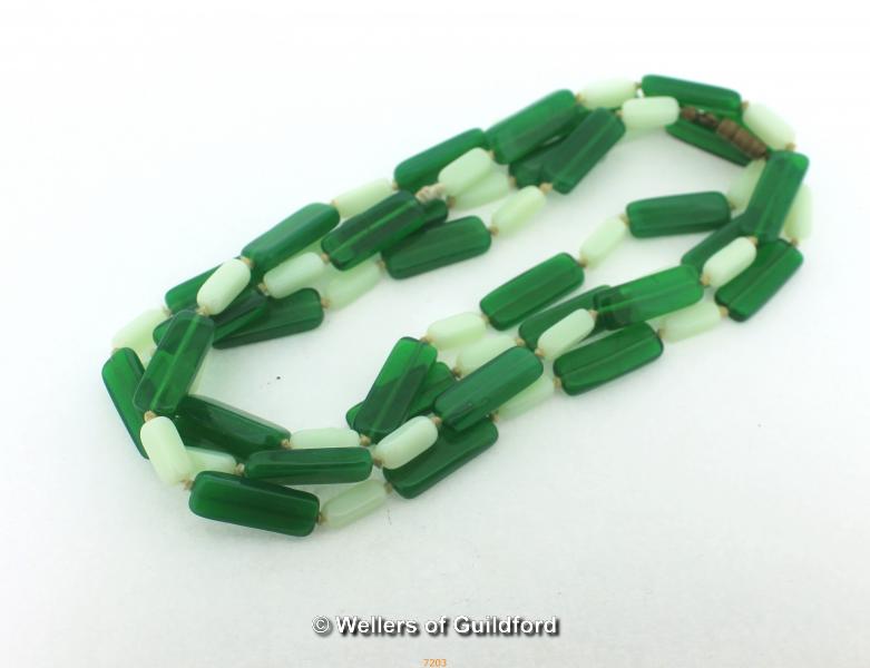 *Vintage Opaline green uranium glass flapper length hand-knotted necklace (Lot subject to VAT)